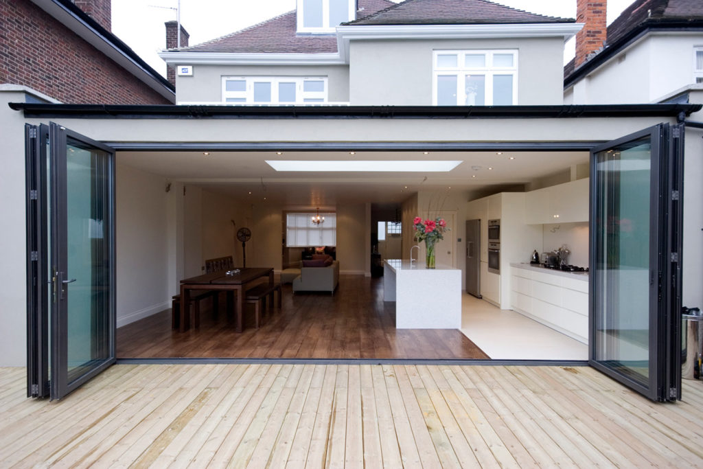 Two storey house in Basingstoke with a rear extension and open bi-fold doors